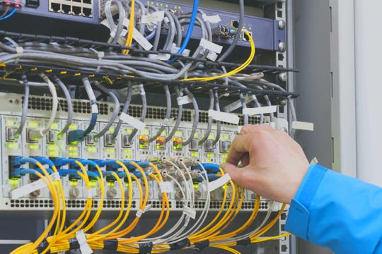 Technician installing ELV equipment